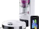 a white and black blender and a cell phone next to it