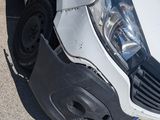 a white van that is sitting on the side of the road