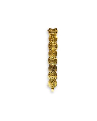 a close up of a gold bracelet with a number of coins on it
