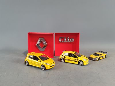 three toy cars are in a red box with a logo on it