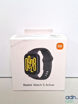 a box with a watch inside of it on a table