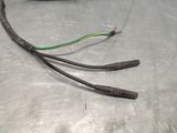 a close up of a metal table with wires on it