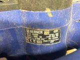 a close up of a blue machine that is on a table