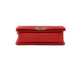 a red purse with a metal clasp on the front