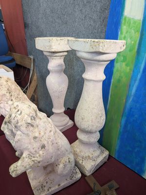 two white vases sitting next to each other on a table