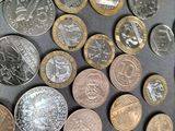 a lot of coins that are on the table