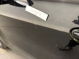 a close up of a car door with a sticker on it