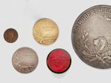 an image of a group of different coins on a white surface