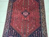 an oriental rug on a tile floor with a white floor