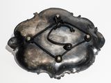 a metal object with a rope around it on a white surface
