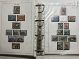 a binder with a lot of stamps on it