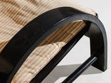 an image of a chair with a cushion on it ' s back