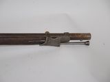 a close up of a gun on a white surface with a white background