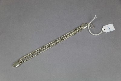 a close up of a chain with a tag attached to it