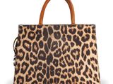 a leopard print handbag with a brown leather handle