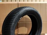 tire on the floor in front of a cardboard box