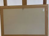 a wooden easel with a mirror on top of it