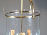 a glass chandelier with corks hanging from it