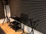 a room that has a bunch of speakers in it