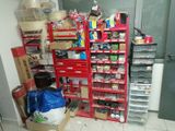 a room with a lot of items on the shelves