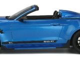 the blue car is parked on a white surface with a white background
