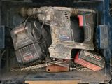 a box with tools inside of it on the floor