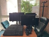 a computer desk with a keyboard and a monitor on it