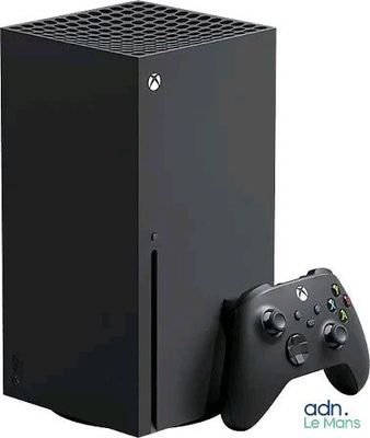 a close up of a black xbox game console and a controller