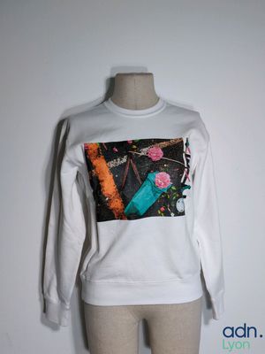 long sleeved t - shirt with a picture of flowers and a bottle of water on it