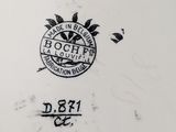 a close up of a plate with a black and white design on it
