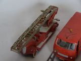 a red fire truck and a red fire truck next to each other