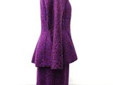 a purple dress and jacket on a mannequin mannequin mannequin mannequin mannequin mannequin mannequin mannequin mann
