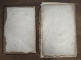 an open book sitting on a wooden table