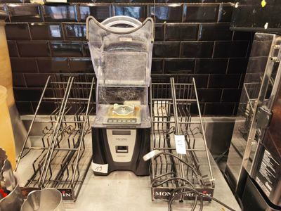 a blender that is sitting on a counter in a kitchen