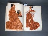 an open book with a drawing of a man and a woman sitting on the ground