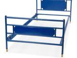 a blue bed with a metal frame and a blue headboard