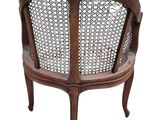 an image of a wooden chair with a woven seat