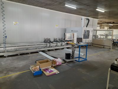 an image of a factory with a large machine in the middle of the room