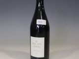 a bottle of wine that is sitting on a table