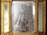 a picture of a gold frame with a mirror in it