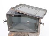 a small metal box with a door on top of it