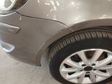 a close up of a car ' s tire on the ground