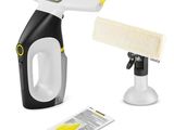 a black and white steam cleaner with a yellow handle