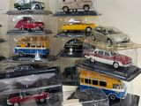 a lot of toy cars that are in a display case