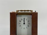 a small clock that is sitting on a table