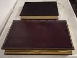 two books that are sitting on a white table