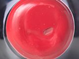 a close up of a bottle of red wine on a table