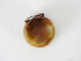 a brown and white object on a white surface