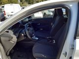 the interior of a car with the door open and the driver ' s seat up