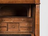an old wooden desk with drawers and a marble top